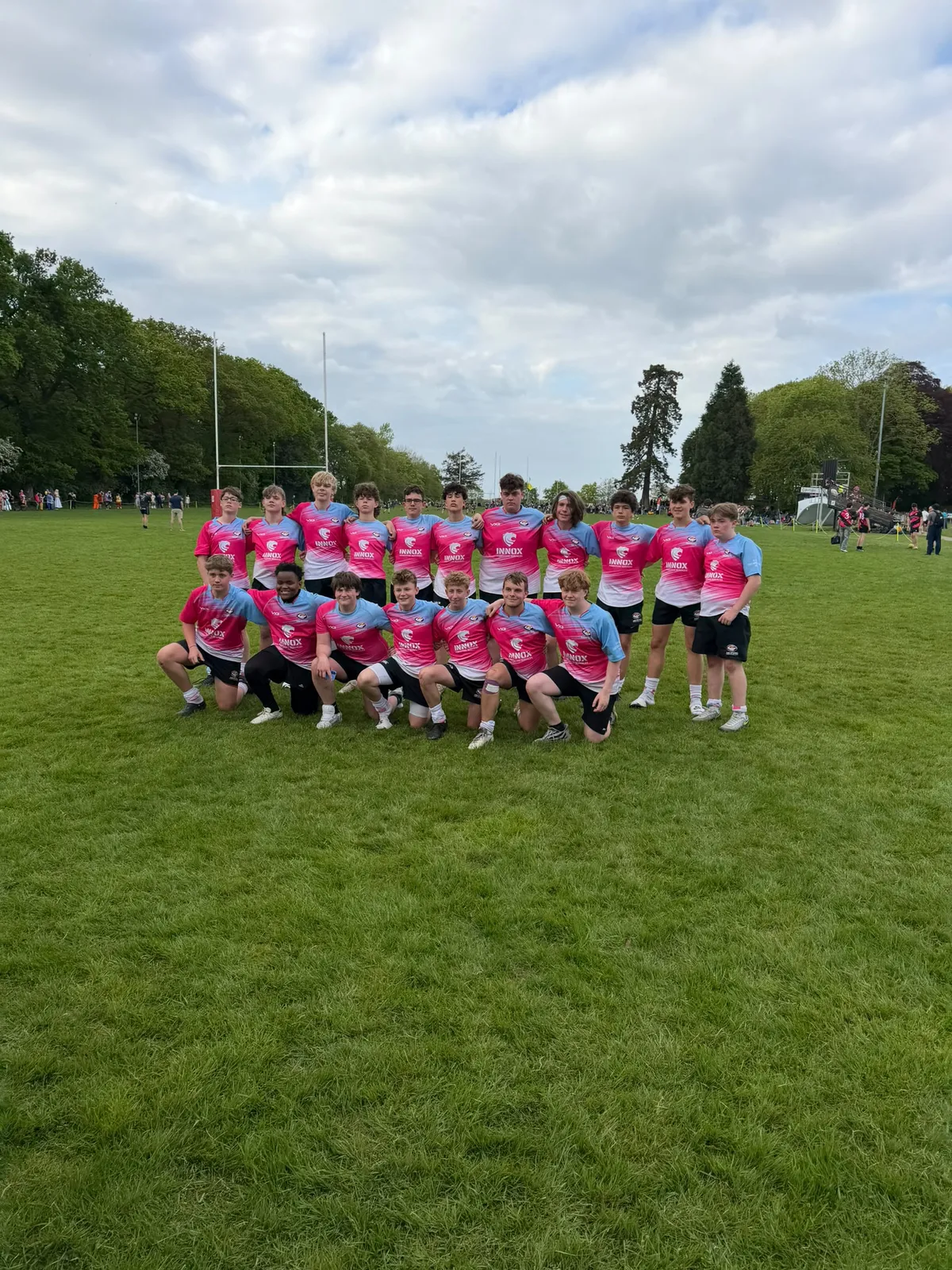 INNOX-sponsored team photo at a rugby festival